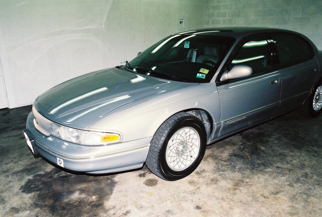 Picture of gold 1994 Chrysler LHS in garage.