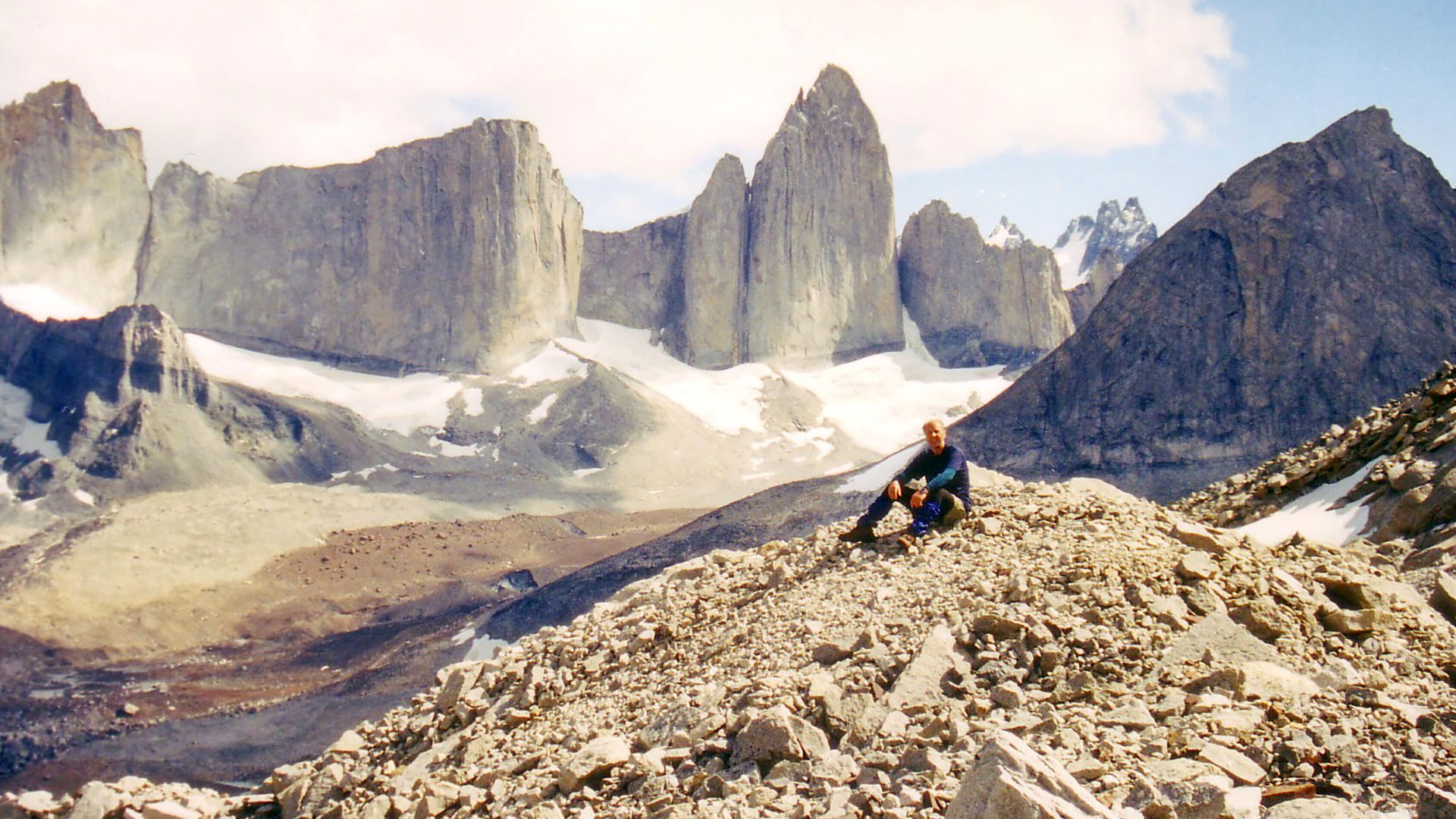 Eric Robinson sits on a rock pile at Torres del Paine in Patagonia