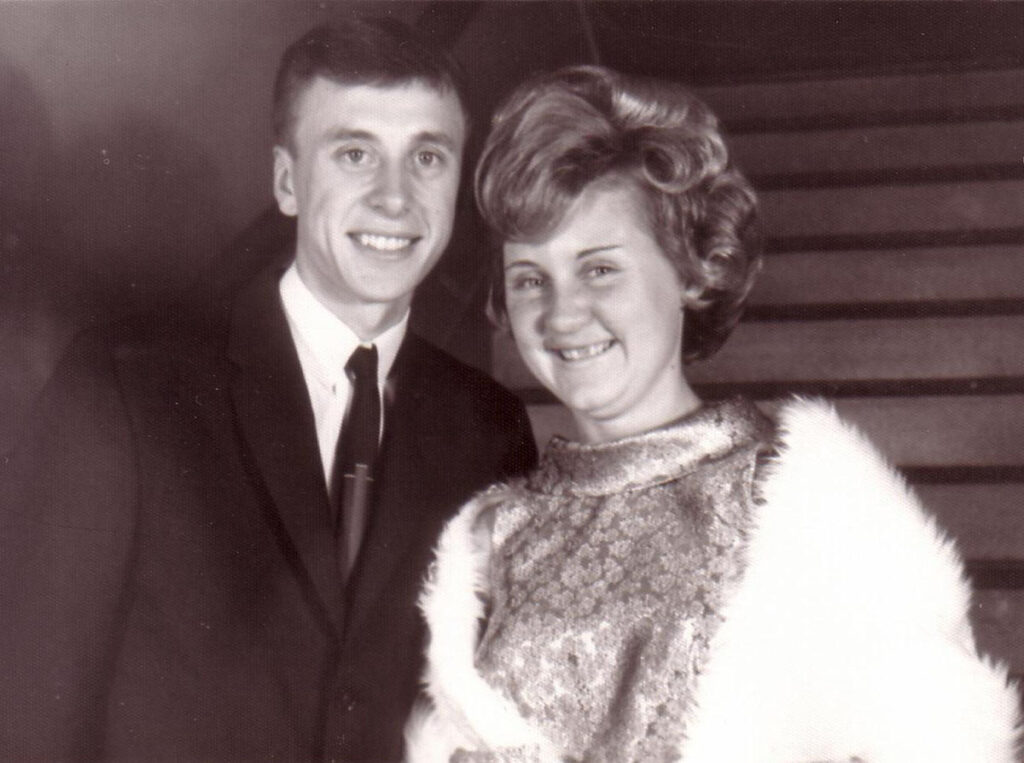 Eric Robinson and his bride Helen Petiach pose and smile on their wedding day