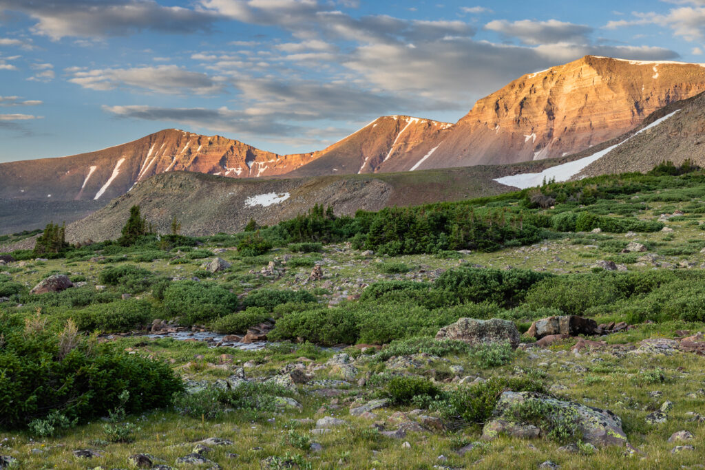Mountain scenery with soft sunrise light on high barren peaks