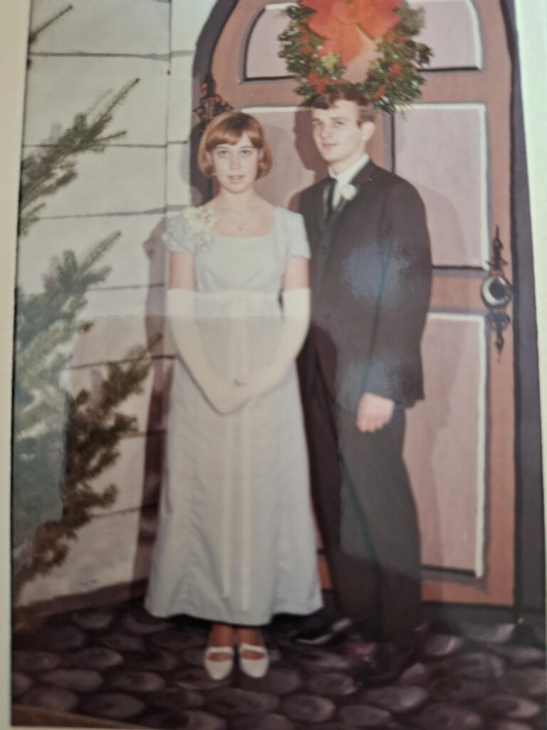 A young couple dressed up.